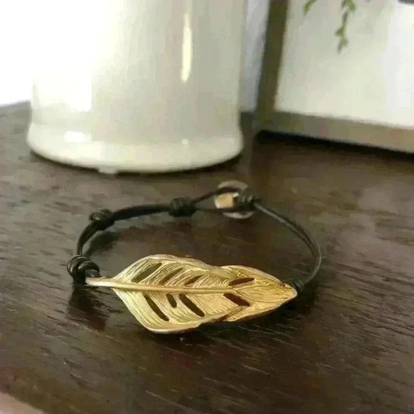 Chloe + Isabel black adjustable cord antique gold plated feather bracelet - Picture 2 of 6